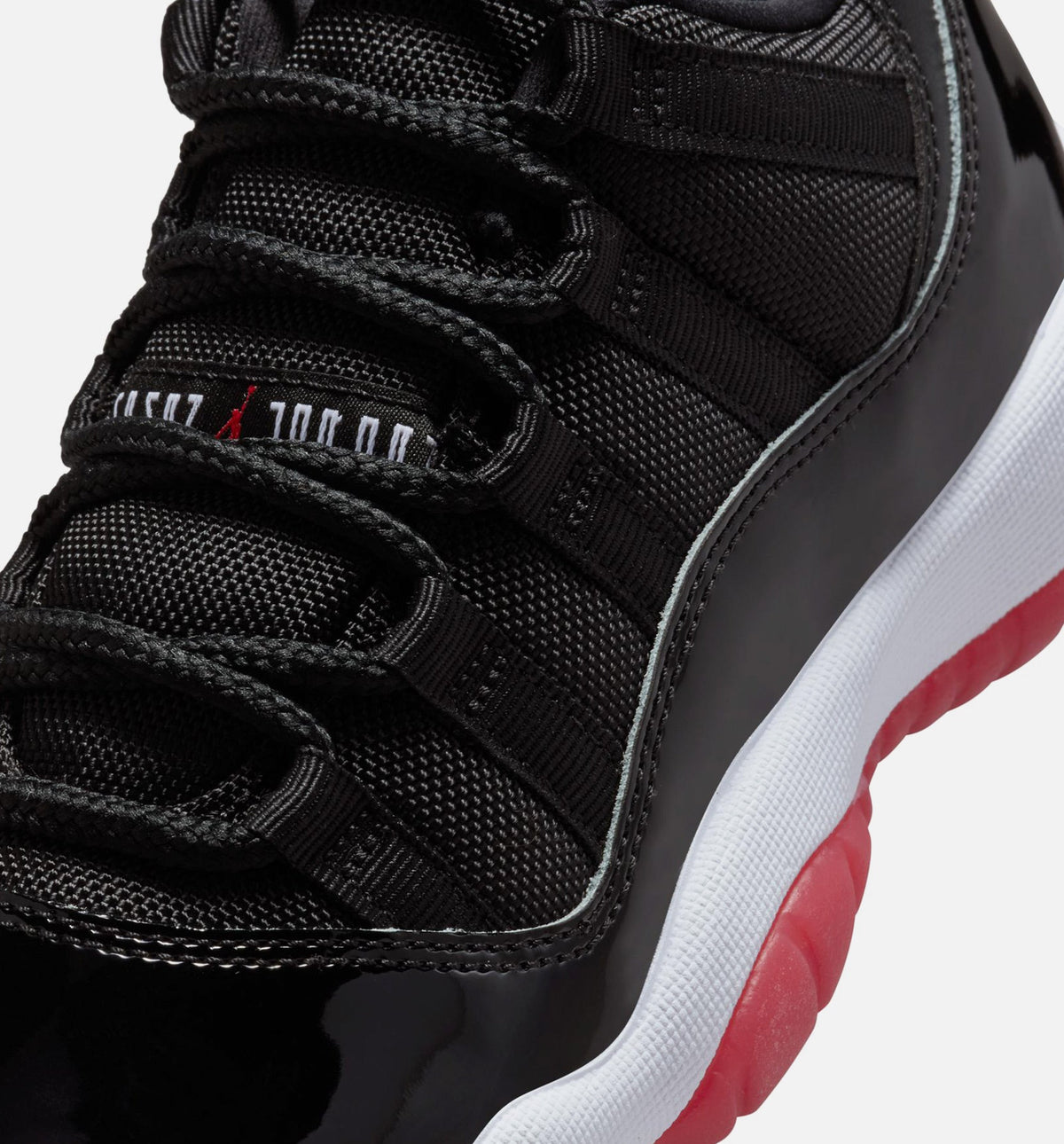 Air Jordan 11 Retro Bred – Grade School Lifestyle Sneaker (Black / Varsity Red / White)
